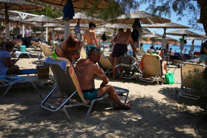 Priced out by luxury resorts, Greek tourists settle for cheaper, shorter vacations
