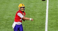 Brian Kelly updates the status of an LSU football quarterback who hurt his throwing hand