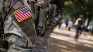 National Guard vehicle crashes with car on Capitol Hill, trapping 1 person