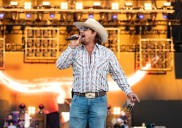 Gavin Adcock dodges charging fan onstage as security swoops in
