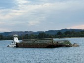 Grain barge takes on water in Columbia River before being righted near Kalama