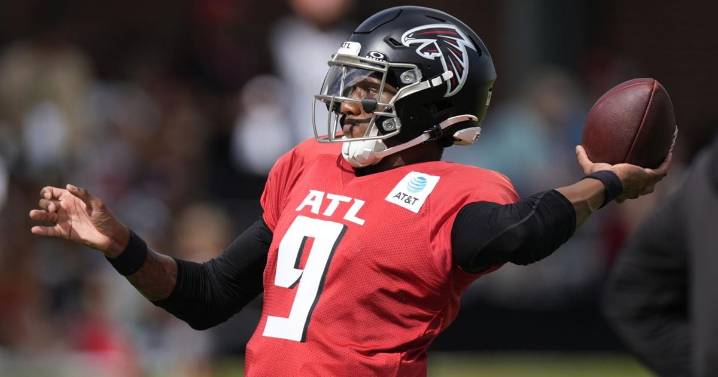 Falcons QB Michael Penix Jr. lands at bottom of pile during joint