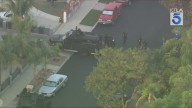 Police officers, SWAT team engaged in standoff with armed man at L.A. home 
