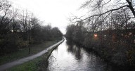 Large emergency services presence at canal after man falls in water