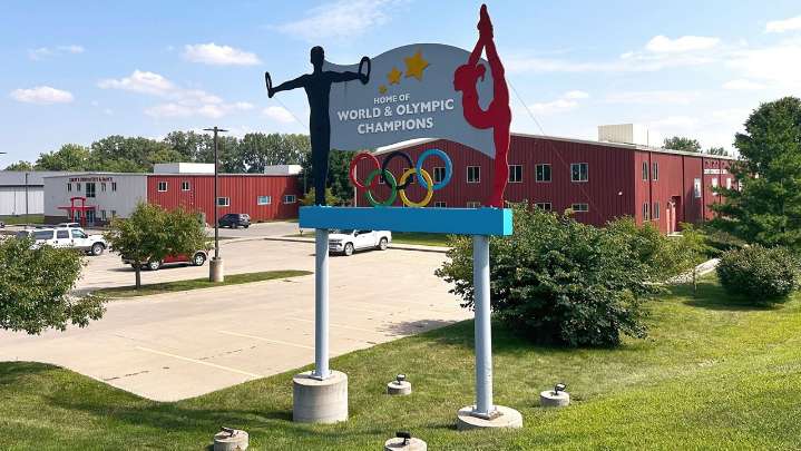 Years after abuse reports, ex-coach at renowned U.S. gymnastics academy is arrested by FBI