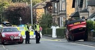 Glasgow road locked down after horror smash sees car flip onto roof