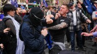 Clashes as thousands rally against immigration in Australia, in protests government has linked to neo