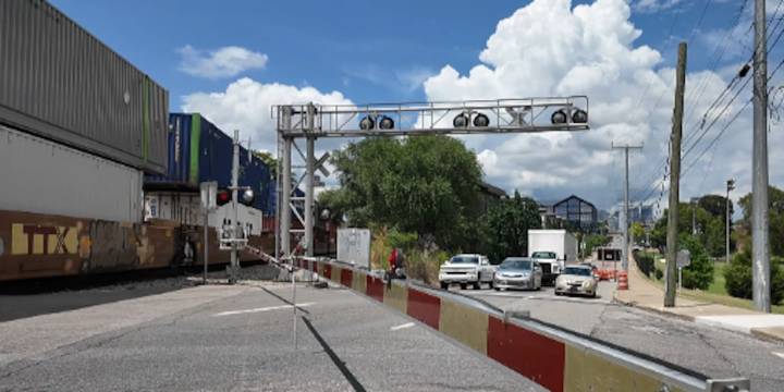 Blocked train crossings trap drivers, force pedestrians to climb through cars