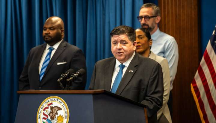 Pritzker's signature on police pension bill adds pressure for state bailout and city property tax hike