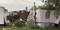 Large tree destroys mobile home, traps man in west Lincoln