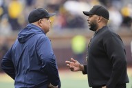 Michigan football fined 10s of millions of dollars, Moore suspended 3 games in sign