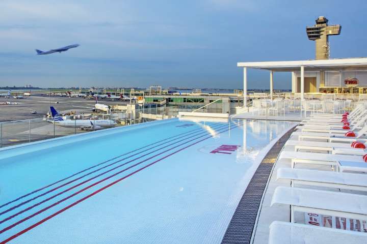 North America’s Best Airport Hotel Is In NYC – With A Year-Round Rooftop Pool, Twister Room, & Airplane