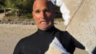 Terrifying shark attack is caught on camera as beast chomps giant bite out of surfer’s board in horror near