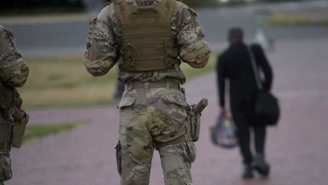 Some Guard units in Washington are now carrying firearms, Pentagon says
