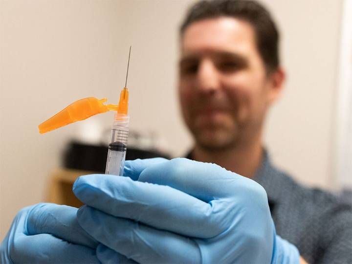 'We can't keep doing it this way': Smith defends province's decision to charge $100 for COVID shots