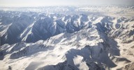Climber dies trying to rescue injured Russian woman from Kyrgystan's highest mountain; search halted