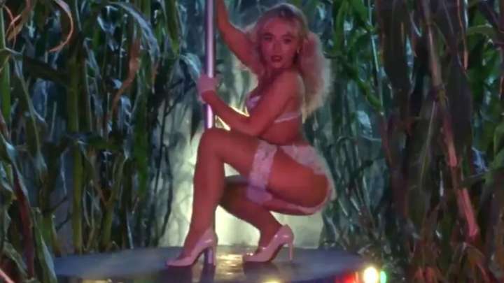 Sabrina Carpenter strips off to stockings and suspenders to pole dance in new video for Tears