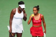 Venus Williams wins a US Open women's doubles match for the 1st time since 2014