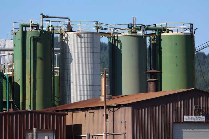An Oregon wood treater kept polluting a town’s water source with a now-banned chemical — but regulators didn’t stop it
