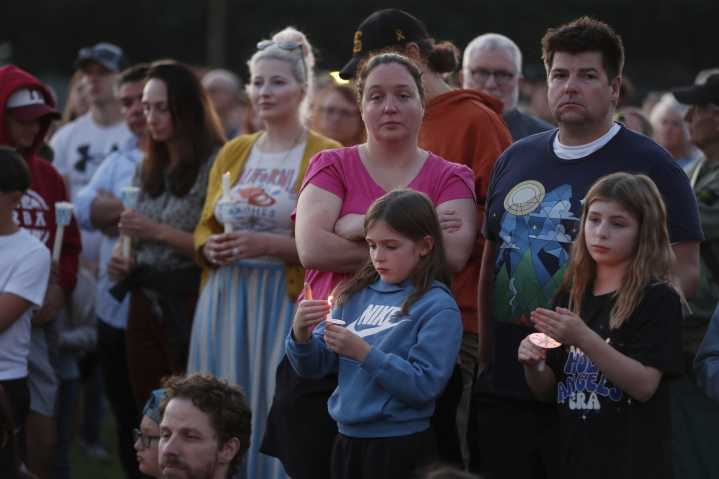 Hundreds honor 2 children killed and 17 people wounded in shooting at a Minneapolis Catholic school