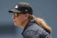 Female umpire’s first game features few dramatic calls