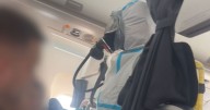 Moment firefighters in hazmat suits swarm BA plane as crew members 'collapse'