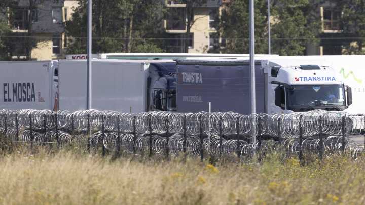 13 freezing UK-bound migrants found trapped in fridge lorry after driver heard them ‘screaming for help’ near Calais