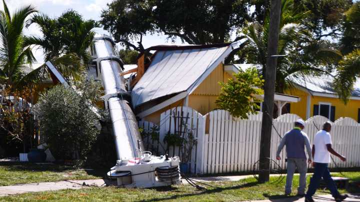 See the photos: House crushed by crane on Merritt Island
