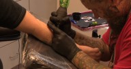 Community uses tattoos to honor Lorain officers after deadly ambush