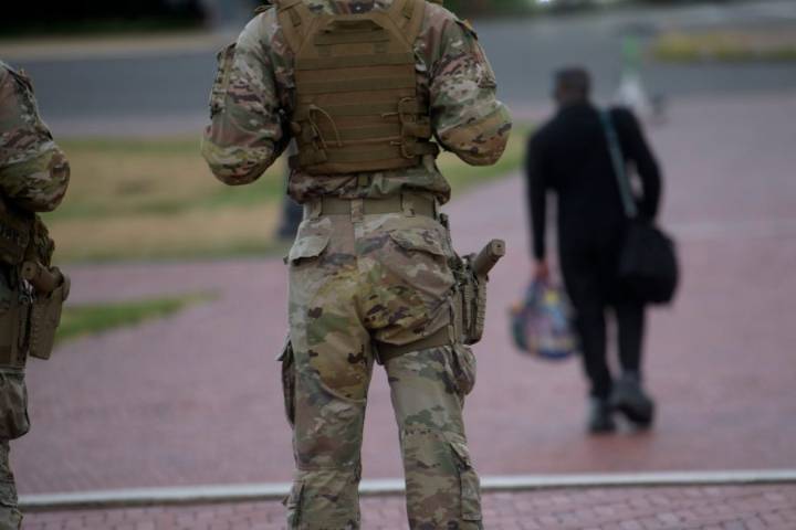 Some National Guard units in Washington are now carrying firearms in escalation of Trump deployment