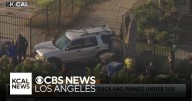 Vehicle crashes into a home’s fence and a pedestrian in Watts
