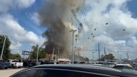 Gas line explosion sends debris flying