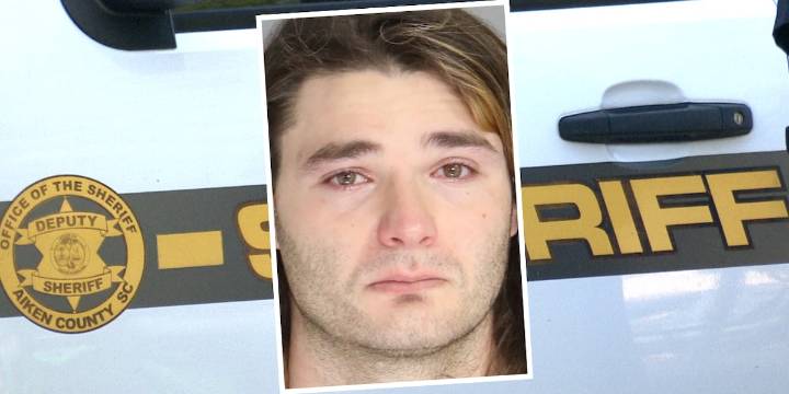 Man arrested after allegedly shooting at vehicle with 2 people inside