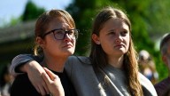 A shooting at a Minneapolis Catholic school kills 2 children, injures 17 people