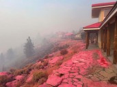 Firefighters try to corral California forest blaze as lightning strikes bring risk of new ignitions