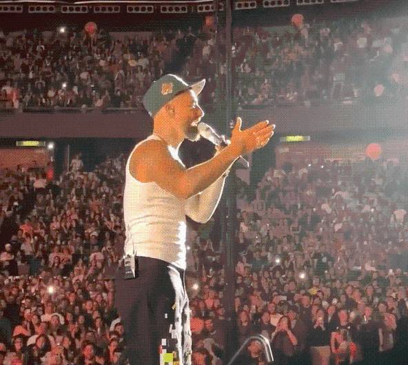 Moment rapper stops concert to 26,000 fans to berate ‘irresponsible’ mum who brought her one