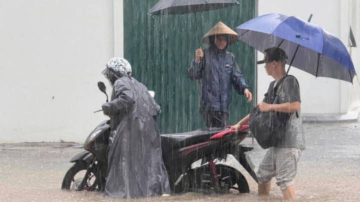 Heavy rain falls in parts of Southeast Asia after tropical storm blows into Vietnam