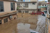 Floods in Pakistan wash away homes and leave at least 220 dead
