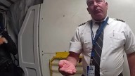 Shock moment ‘drunk’ pilot who ‘reeked of boozed’ is escorted by cops from cockpit moments before takeoff