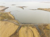 Excavator-turned-landmark stuck in Saskatchewan lake removed 11 years later