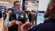 Wall Street holds at a standstill near its record heights