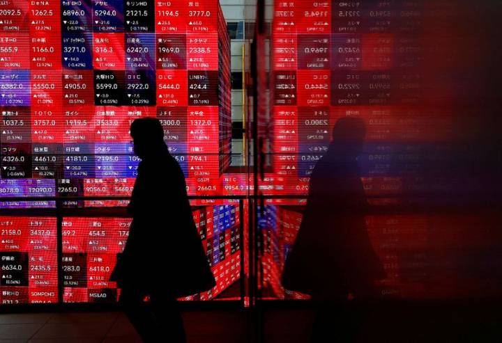 Japan's Nikkei hits record high as automakers rise on weaker yen