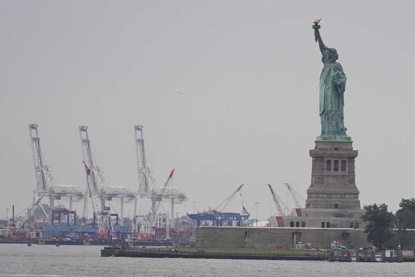 Trump’s new tariffs go into effect as US economy shows signs of strain