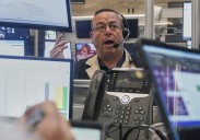 Stocks pull back from their latest all-time highs on Wall Street