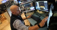 A late push sends Wall Street near its records