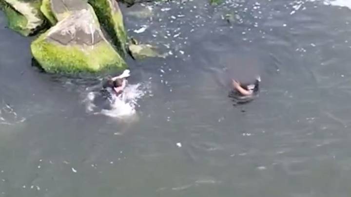 VIDEO: NYPD cops jump into ocean to chase car thief who leapt off Far Rockaway dock