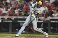 Yelich hits 2 HRs as MLB-best Brewers rally past Reds 10-8, tie club record with 13th straight win