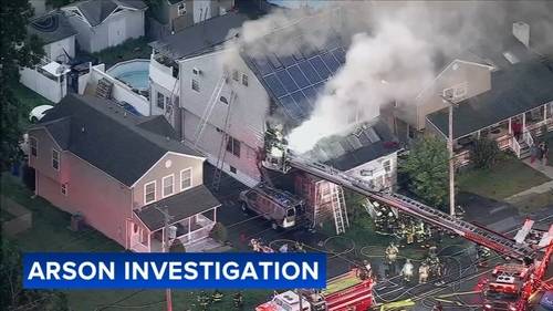Surveillance video shows van intentionally set on fire in Croydon, flames spread to home