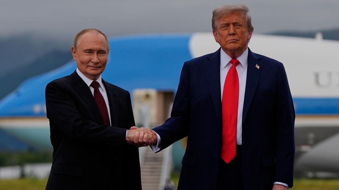 Trump and Putin share handshake in Alaska, a warm greeting belying the bloodshed in Ukraine