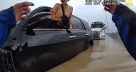 CAUGHT ON CAMERA: Chattanooga officer helps drivers (and a dog) out of flooded cars